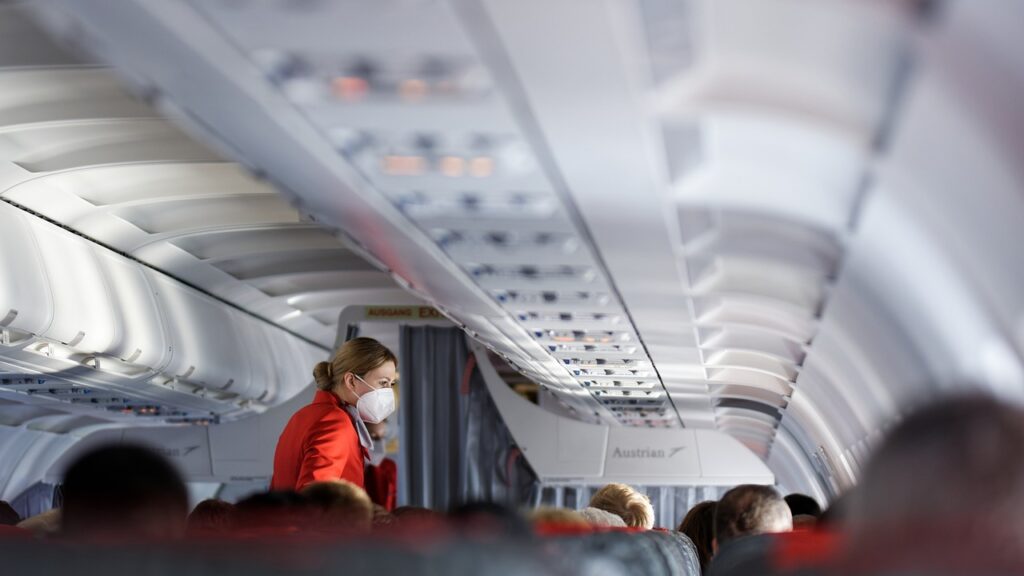 Avoid Getting Bumped From a Flight stewardess, airplane, airplane cabin